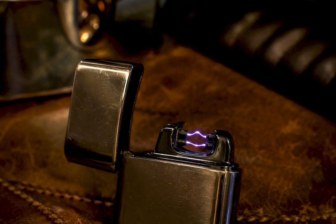 Close-up of electric arc lighter glowing
