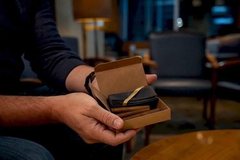 Hands offering anonymous cigarillos after birth