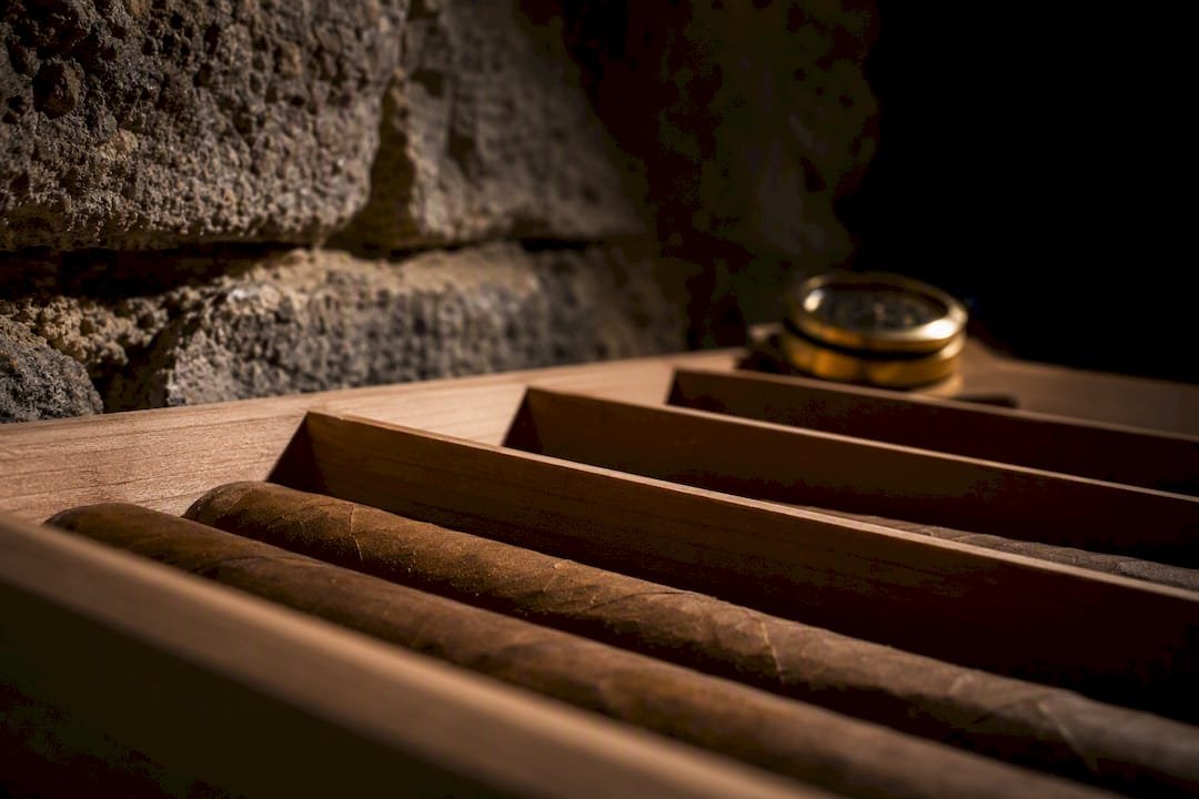 Anonymous cigars resting in cedar for aging