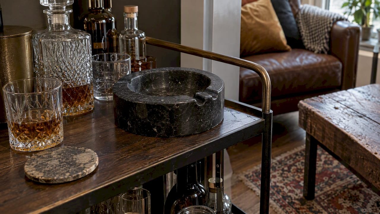 Matte stone cigar ashtray on a home bar cart